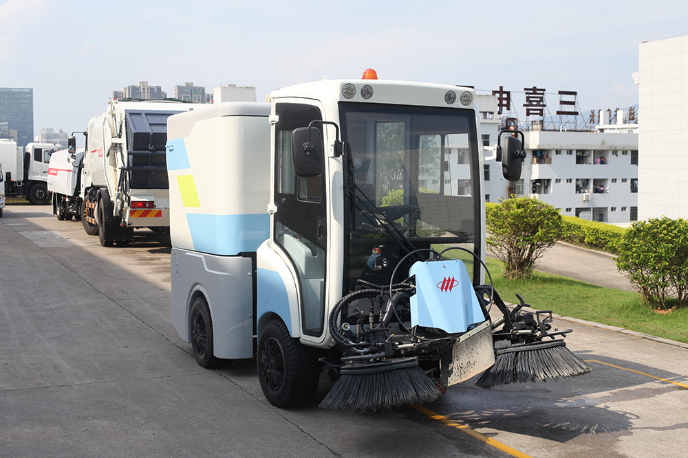 Performance and structural characteristics of FULONGMA intelligent electric road sweeper FULONGMA Intelligent Electric Road Sweeper is an automatic cleaning integrated machine that combines road dust collection, sweeping, water spraying, and garbage transportation. It is a new type of cleaning equipment used in outdoor environments. The intelligent electric road sweeper is suitable for outdoor cleaning in parks, sanitation, cleaning companies, property management companies, squares, universities, highways, squares, etc. 01. Picture of Smart Electric Road Sweeper 02. Performance characteristics of intelligent electric road sweeper 1. Electric operation, no noise, no exhaust gas emissions, clean and environmentally friendly. 2. Small size, flexible turning, easy to drive, convenient maintenance, suitable for most manual cleaning places. 3. Integrate sweeping and suction, no secondary pollution, no secondary dust. 4. The cleaning effect is good, as small as dust and sand, as large as stones, broken bricks, leaves, and cigarette cases, it can be cleaned in one go. 5. Mechanized operation is not only efficient and effective, and the machine is clean wherever it goes, but also avoids the phenomenon of flying dust, difficult dust, and missed sweeping in manual cleaning. 03. Structural characteristics of intelligent electric road sweeper 1. Concise and clear operation interface, suitable for people of all ages to operate. 2. Adopt high-performance maintenance-free battery, no leakage, no harmful gas. 3. Humanized design, equipped with fan. The powerful fan has strong suction power and good sweeping effect. Through the reasonable design of the hydraulic system, the effect of automatically dumping the garbage in the trash can is achieved, thereby greatly reducing the labor intensity of the operator. 4. With cleaning and throwing technology, the theoretical value of the dust box utilization rate is high. 5. Well-known brand parts provide a good foundation for the stable performance of the product. 6. Solid tires, sturdy and durable. 7. Intelligent electronic control system, over-current, under-voltage protection, aggravated chassis, large garbage bin volume. 03. Video of Smart Electric Road Sweeper